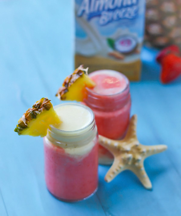 Today’s post full of tropical smoothie goodness is sponsored by my friends at Blue Diamond Almond Breeze.