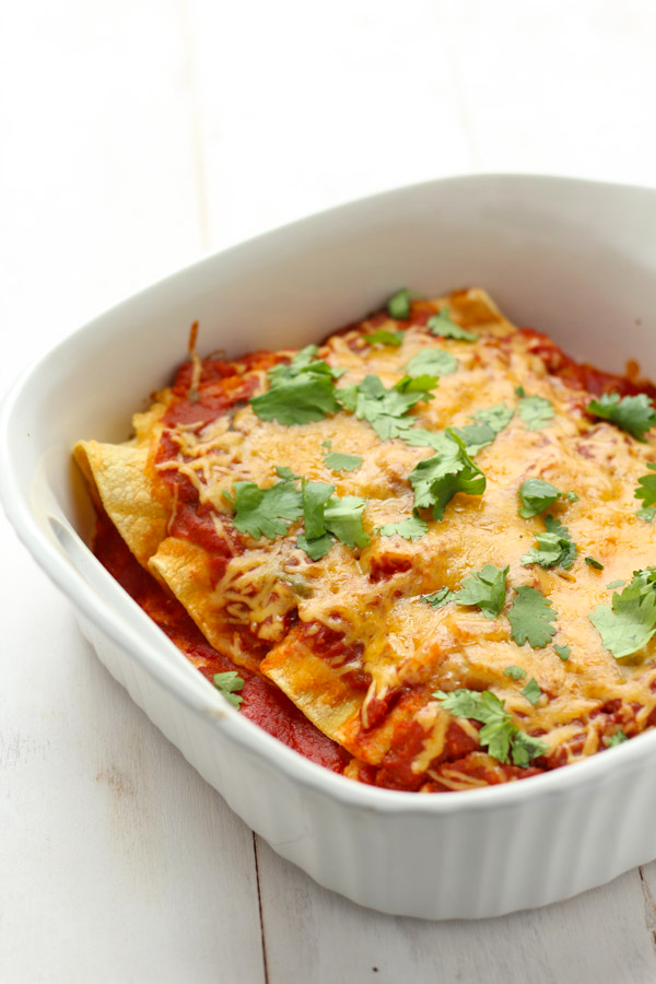 Gluten-free chicken enchiladas with a flavorful pumpkin sauce!