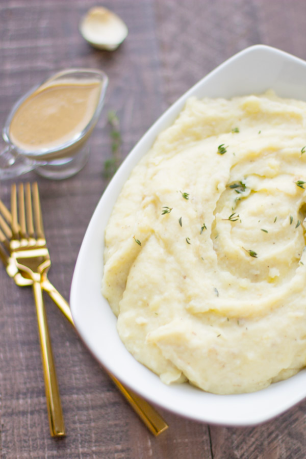 Lightened-up mashed potatoes with cashew gravy - fluffy cauliflower mashed potatoes with creamy gravy!