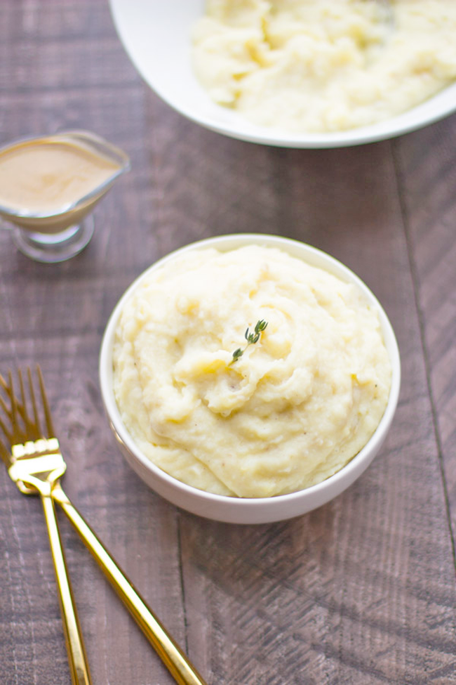 Lightened-up mashed potatoes with cashew gravy - fluffy cauliflower mashed potatoes with creamy gravy!