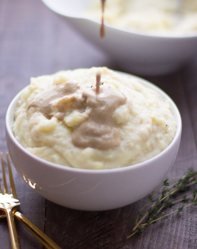 Lightened-up mashed potatoes with cashew gravy - fluffy cauliflower mashed potatoes with creamy gravy!