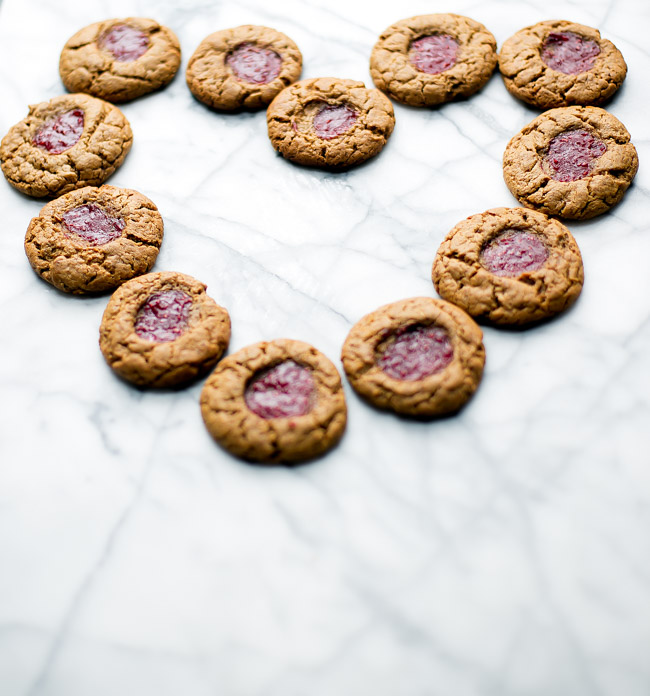 Gluten free peanut butter cookies with a kiss of jam right in the middle. Only requires six ingredients, and comes together in one bowl!