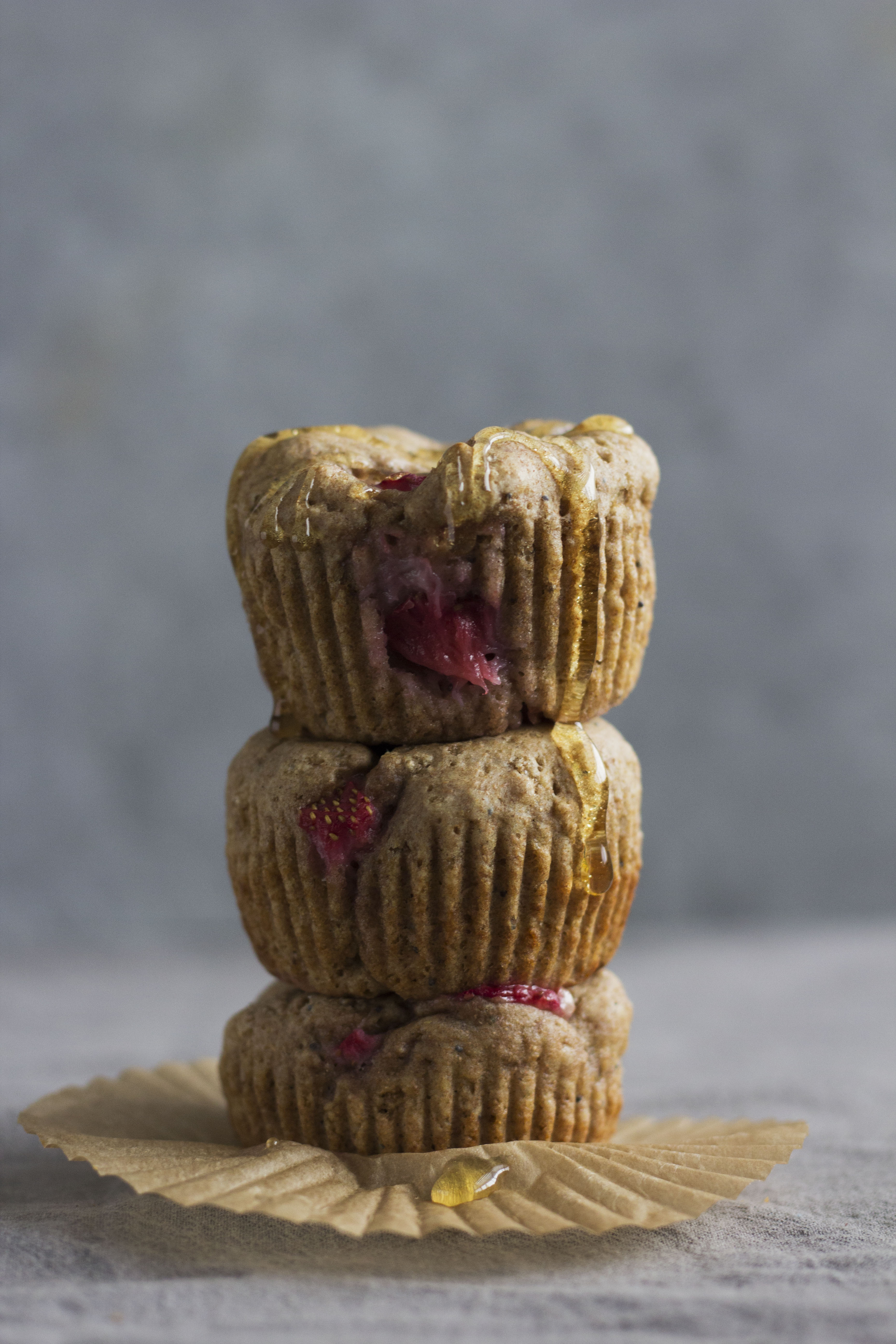 Strawberry Poppy Seed Muffins are the perfect grab-and-go breakfast! Made with fresh strawberries and drizzled with honey, they're sure to be a hit at any brunch. 