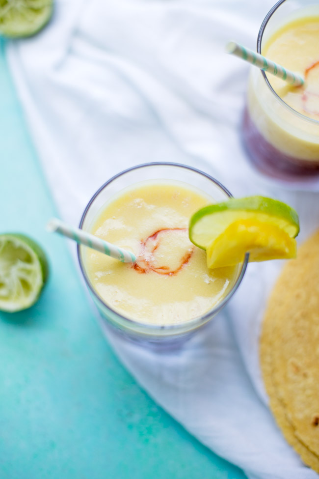 These Pineapple Cherry Margaritas are refreshing, fruity and perfect for your next celebration. They only require a few ingredients and are easy to blend up for a crowd!