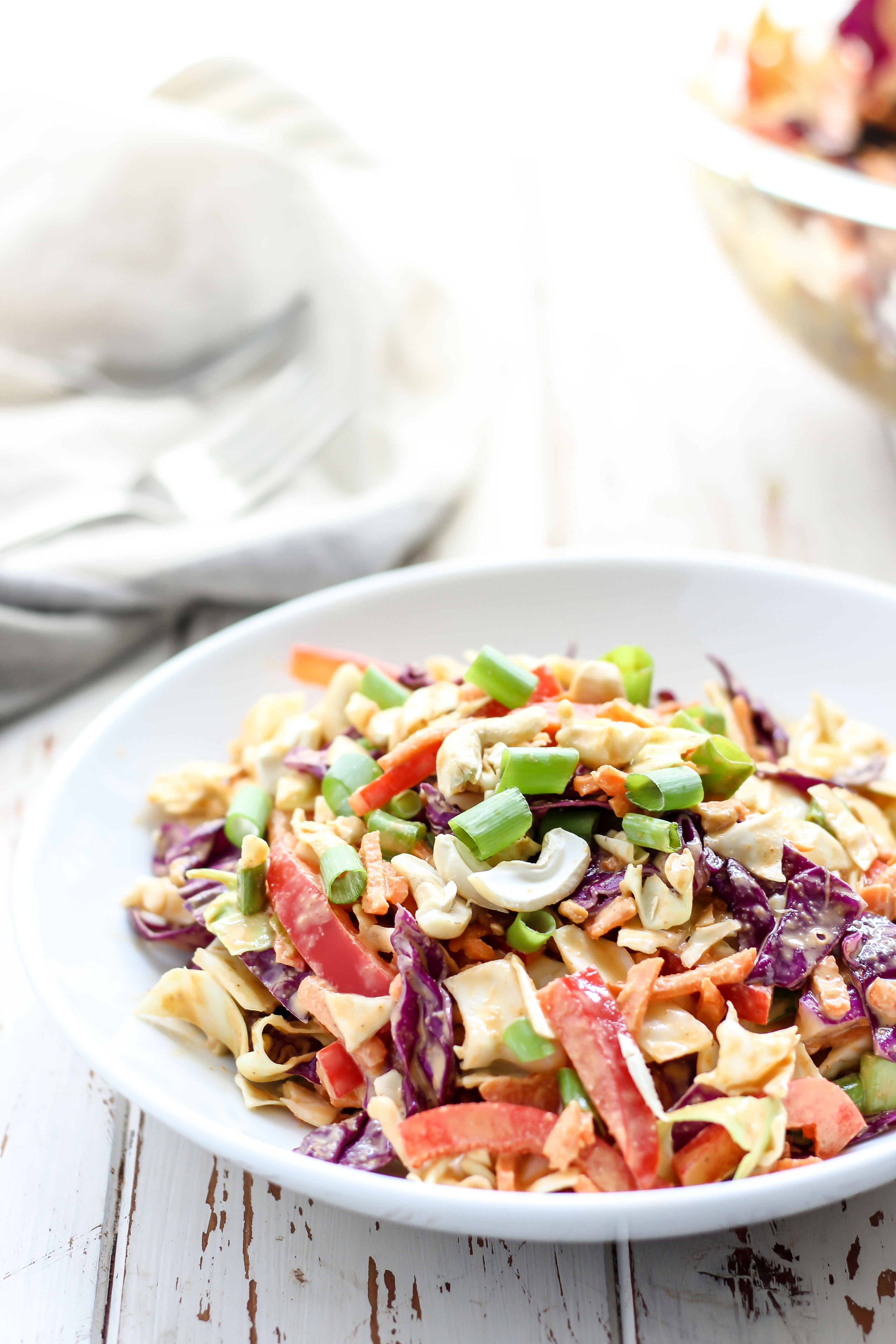 Throw some Asian flare into your coleslaw and make this Thai slaw with cashew curry dressing. Flavorful, fun, and a great addition to any BBQ.