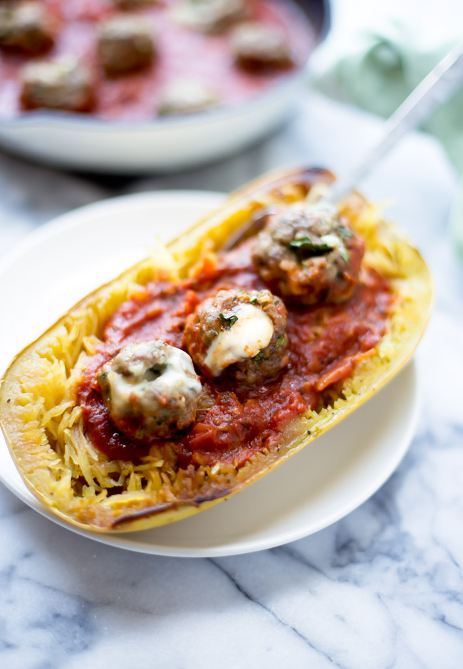 AD - Mozzarella stuffed meatballs with spaghetti squash. A hearty, comforting way to incorporate more organic food in your diet!