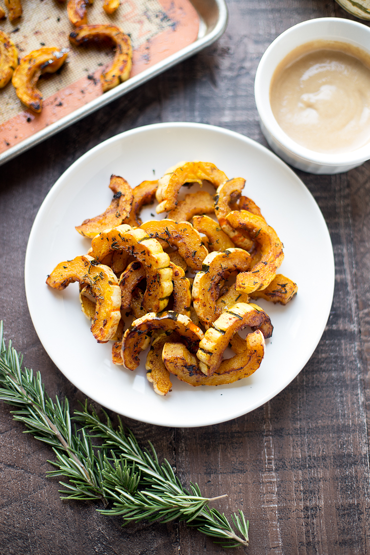 This sweet and savory roasted delicata squash makes the perfect comforting side dish! The maple-tahini sauce adds a subtle sweetness that takes it over the top.