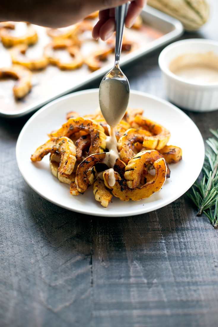 This sweet and savory roasted delicata squash makes the perfect comforting side dish! The maple-tahini sauce adds a subtle sweetness that takes it over the top.