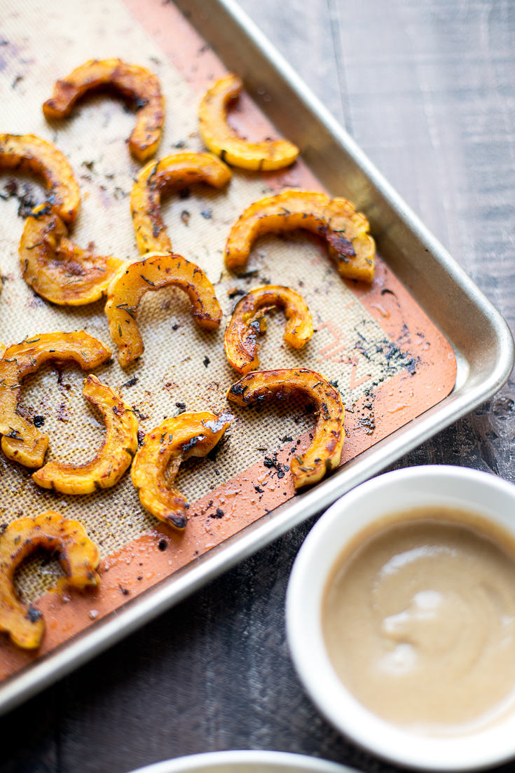 This sweet and savory roasted delicata squash makes the perfect comforting side dish! The maple-tahini sauce adds a subtle sweetness that takes it over the top.